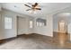 Bright and airy living room featuring an archway, windows with blinds, and tile floors at 9303 Gilcrease Ave # 1056, Las Vegas, NV 89149