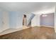 Open-concept living area with tile floors, staircase, and ample natural light at 9303 Gilcrease Ave # 1056, Las Vegas, NV 89149