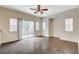 Bright living room with sliding glass door, ceiling fan and plenty of natural light at 9303 Gilcrease Ave # 1056, Las Vegas, NV 89149