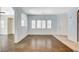 Bright living room with multiple windows, open floor plan, and stylish flooring at 9303 Gilcrease Ave # 1056, Las Vegas, NV 89149