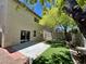Backyard view with lush artificial grass, patio area, and privacy fence at 9452 Plover Falls Ave, Las Vegas, NV 89149