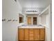 Double sink bathroom with a large mirror and vanity lighting at 9452 Plover Falls Ave, Las Vegas, NV 89149