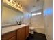 Bathroom with a vanity, large mirror, and tub with shower fixture at 9452 Plover Falls Ave, Las Vegas, NV 89149