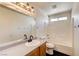 Well-appointed bathroom with a large mirror, vanity, and shower-tub combo for comfort and convenience at 9452 Plover Falls Ave, Las Vegas, NV 89149