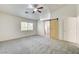 Spacious bedroom featuring a vaulted ceiling, fan, and bright window at 9452 Plover Falls Ave, Las Vegas, NV 89149