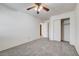 Bright bedroom with plush carpeting, closet, and ceiling fan, ideal for relaxation and storage at 9452 Plover Falls Ave, Las Vegas, NV 89149