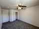 Bedroom featuring neutral walls, a ceiling fan, closet, and neutral carpet at 9452 Plover Falls Ave, Las Vegas, NV 89149