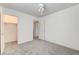 Cozy bedroom with plush carpeting, ample closet space, and a contemporary ceiling fan at 9452 Plover Falls Ave, Las Vegas, NV 89149
