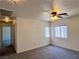 Comfortable bedroom with plush carpet, a ceiling fan, and windows providing natural light for a relaxing atmosphere at 9452 Plover Falls Ave, Las Vegas, NV 89149