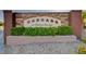 Stone sign at Cascade at Elkhorn Springs featuring a lush planted landscape at 9452 Plover Falls Ave, Las Vegas, NV 89149
