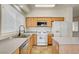 This bright kitchen features a stainless steel sink, oven, and tiled floors at 9452 Plover Falls Ave, Las Vegas, NV 89149