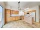 Charming kitchen offers wood cabinets, tile floors, and stainless steel appliances at 9452 Plover Falls Ave, Las Vegas, NV 89149