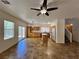 Open kitchen with tile flooring, stainless steel appliances, an island, and access to a backyard patio at 9452 Plover Falls Ave, Las Vegas, NV 89149