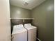 Convenient laundry room with a side-by-side washer and dryer at 9452 Plover Falls Ave, Las Vegas, NV 89149