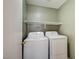 Efficient laundry area with modern washer and dryer, designed for seamless chore management at 9452 Plover Falls Ave, Las Vegas, NV 89149