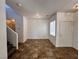 Well-lit living room showcasing tile floors, a staircase, and a view of the front entrance at 9452 Plover Falls Ave, Las Vegas, NV 89149