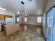Spacious living room with tile floors, ample natural light, and access to the backyard through sliding glass doors at 9452 Plover Falls Ave, Las Vegas, NV 89149