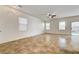 Spacious living room with sliding glass doors that lead to the backyard and bring in natural light at 9452 Plover Falls Ave, Las Vegas, NV 89149