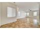 Open living space with neutral walls, tile flooring, and modern ceiling fan at 9452 Plover Falls Ave, Las Vegas, NV 89149