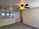 Inviting loft featuring plush carpeting, a ceiling fan, and natural light creating a comfortable and welcoming space at 9452 Plover Falls Ave, Las Vegas, NV 89149