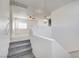 Carpeted staircase leading to a bonus room with a ceiling fan at 9452 Plover Falls Ave, Las Vegas, NV 89149
