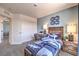 Lovely bedroom with blue accent wall and shark-themed decor, featuring a twin bed and workspace at 10400 Luna Mezzo St Ave # Lot 193, Las Vegas, NV 89141
