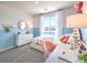 A cozy bedroom with a floral bedspread, playful decor, and a functional desk area at 10400 Luna Mezzo St Ave # Lot 193, Las Vegas, NV 89141