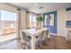 Light-filled dining area with sliding glass door leading to outdoor patio, next to blue accent wall at 10400 Luna Mezzo St Ave # Lot 193, Las Vegas, NV 89141