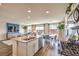 Open floor plan shows kitchen island, dining area, and living room with lots of natural light at 10400 Luna Mezzo St Ave # Lot 193, Las Vegas, NV 89141