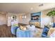 Relaxing living room with modern blue accents, hardwood flooring, and a cozy, inviting atmosphere at 10400 Luna Mezzo St Ave # Lot 193, Las Vegas, NV 89141