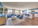 Open-concept living room boasts modern decor, flowing into a bright, white kitchen, perfect for entertaining at 10400 Luna Mezzo St Ave # Lot 193, Las Vegas, NV 89141