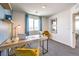 Bright office featuring a wooden desk with a globe, modern decor, and a comfortable yellow chair at 10400 Luna Mezzo St Ave # Lot 193, Las Vegas, NV 89141