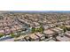 A high aerial view shows a vast neighborhood of similar homes at 10692 Tulip Valley Rd, Las Vegas, NV 89179