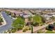 Aerial view of a home featuring drought-tolerant landscaping, a tile roof, an attached garage, and a block wall at 10692 Tulip Valley Rd, Las Vegas, NV 89179