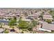 View of the neighborhood featuring single Gathering homes and a well-manicured property with desert landscaping at 10692 Tulip Valley Rd, Las Vegas, NV 89179