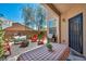 Charming backyard patio area, perfect for entertaining with a BBQ grill and comfortable seating around a cozy fire pit at 10692 Tulip Valley Rd, Las Vegas, NV 89179