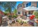 Serene backyard with a cozy patio area, lush vegetation, and comfortable seating, perfect for outdoor relaxation at 10692 Tulip Valley Rd, Las Vegas, NV 89179