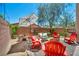 Inviting backyard featuring gravel, decorative rocks, comfortable seating, and shade for relaxing and entertaining at 10692 Tulip Valley Rd, Las Vegas, NV 89179