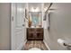 Charming half bathroom with wood-look floors and modern fixtures at 10692 Tulip Valley Rd, Las Vegas, NV 89179