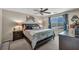 The bedroom offers a comfortable bed, stylish decor, and natural light at 10692 Tulip Valley Rd, Las Vegas, NV 89179