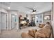 Spacious bonus room featuring a comfortable seating area and a functional built-in desk and storage area at 10692 Tulip Valley Rd, Las Vegas, NV 89179