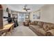 Cozy bonus room featuring a comfortable sofa and a practical built-in desk and storage area at 10692 Tulip Valley Rd, Las Vegas, NV 89179