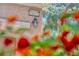 Close-up of the house number with exterior lighting and decorative flower detail in view at 10692 Tulip Valley Rd, Las Vegas, NV 89179