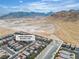 An aerial view of the neighborhood, showcasing the proximity to the surrounding mountains and desert landscape at 10836 Montana Blanca Ave, Las Vegas, NV 89166