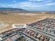 An aerial view showing the neighborhood, mountains, and desert landscape surrounding the property at 10836 Montana Blanca Ave, Las Vegas, NV 89166