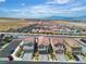 An aerial view of the homes in the surrounding neighborhood with mountain views at 10836 Montana Blanca Ave, Las Vegas, NV 89166