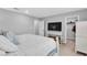 Cozy bedroom featuring a comfy bed, television, closet and natural light at 10836 Montana Blanca Ave, Las Vegas, NV 89166