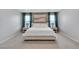 Bright bedroom features a king-size bed, modern decor, and a bright natural light at 10836 Montana Blanca Ave, Las Vegas, NV 89166