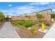 View of the Community park area with grass and surrounding homes on a sunny day at 10836 Montana Blanca Ave, Las Vegas, NV 89166