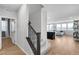 Hallway with wood floors leading to living room and staircase to the left at 10836 Montana Blanca Ave, Las Vegas, NV 89166